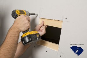 Cut a hole in drywall